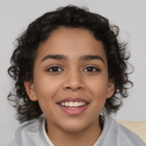 Joyful latino child female with medium  brown hair and brown eyes