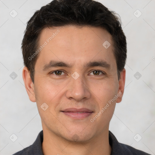 Joyful white adult male with short  brown hair and brown eyes