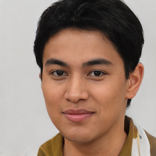 Joyful asian young-adult male with short  brown hair and brown eyes