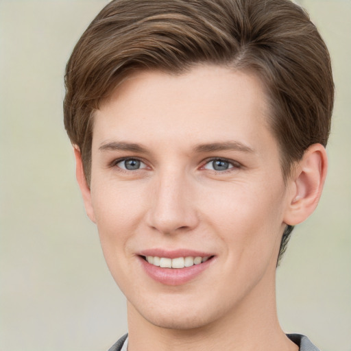 Joyful white young-adult female with short  brown hair and grey eyes