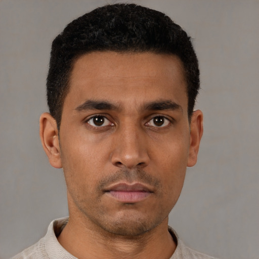 Neutral latino young-adult male with short  black hair and brown eyes