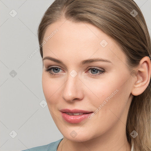 Joyful white young-adult female with long  brown hair and grey eyes