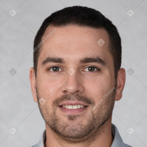 Joyful white young-adult male with short  brown hair and brown eyes