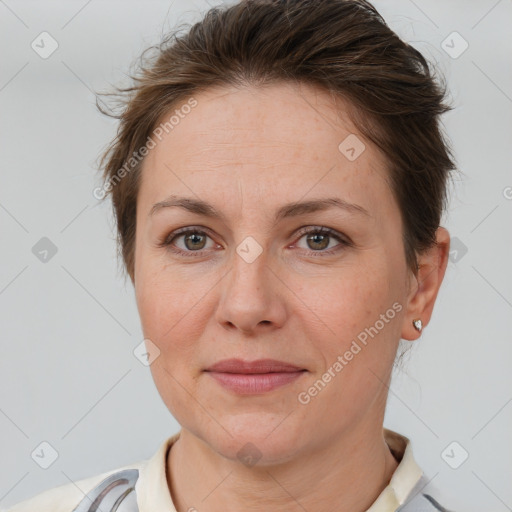 Joyful white adult female with short  brown hair and brown eyes