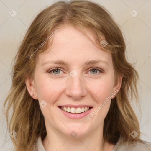 Joyful white young-adult female with medium  brown hair and blue eyes