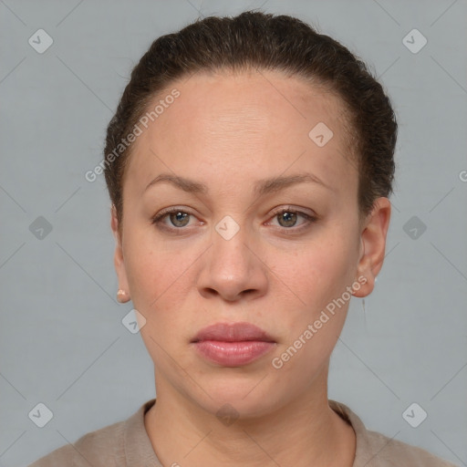 Joyful white adult female with short  brown hair and brown eyes