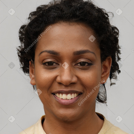 Joyful black young-adult female with short  brown hair and brown eyes