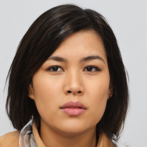 Neutral asian young-adult female with medium  brown hair and brown eyes