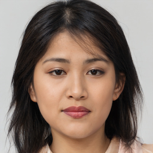 Neutral asian young-adult female with medium  brown hair and brown eyes