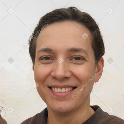 Joyful white adult female with short  brown hair and brown eyes