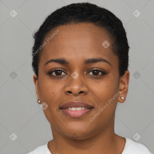 Joyful black young-adult female with short  black hair and brown eyes