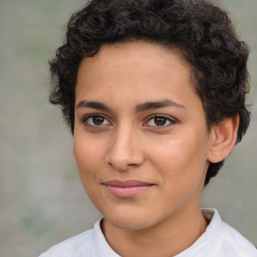 Joyful latino young-adult female with short  brown hair and brown eyes