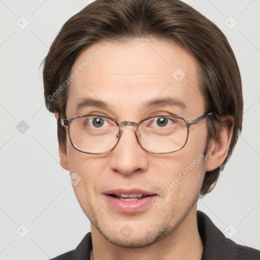 Joyful white adult male with short  brown hair and grey eyes