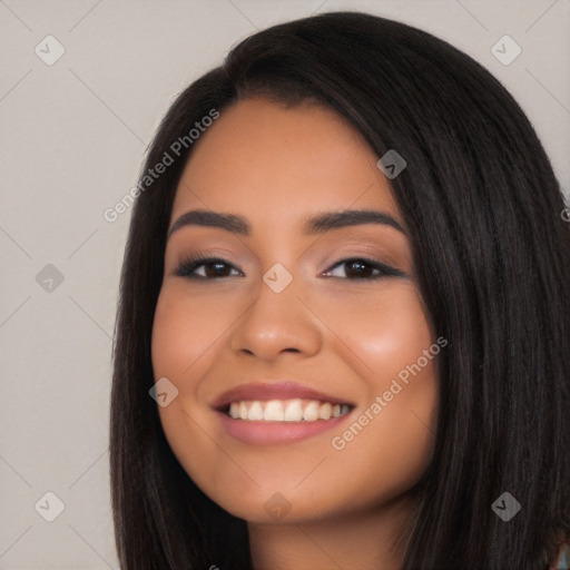 Joyful latino young-adult female with long  black hair and brown eyes