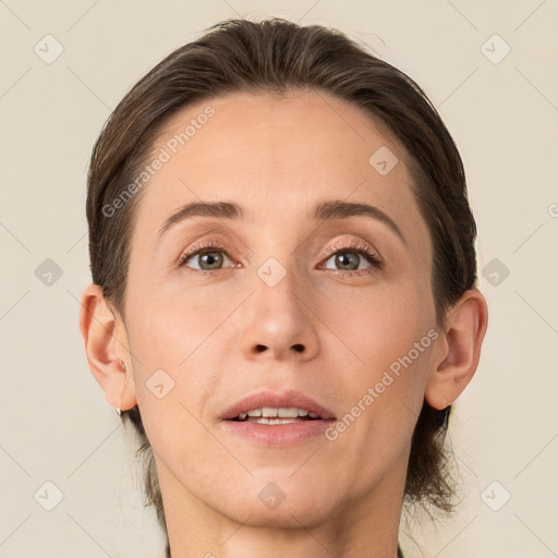 Joyful white adult female with medium  brown hair and grey eyes