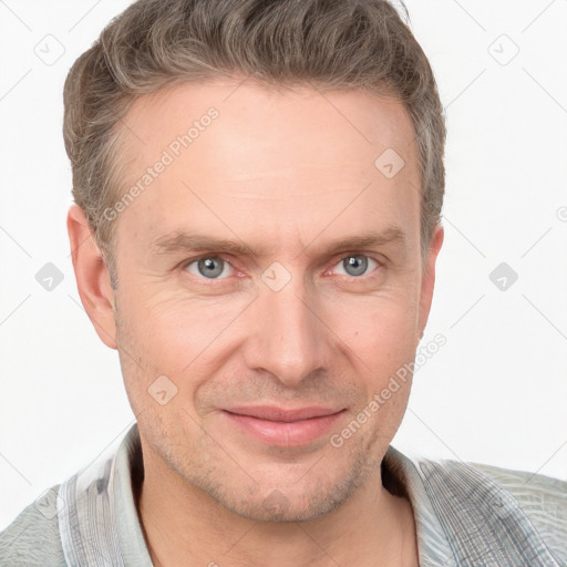 Joyful white adult male with short  brown hair and grey eyes