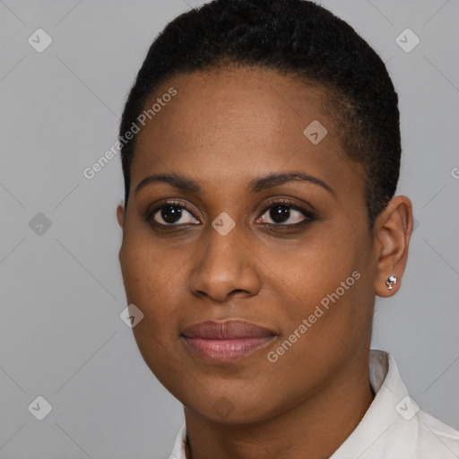 Joyful black young-adult female with short  brown hair and brown eyes