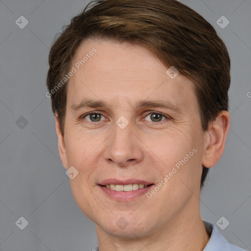 Joyful white adult male with short  brown hair and grey eyes