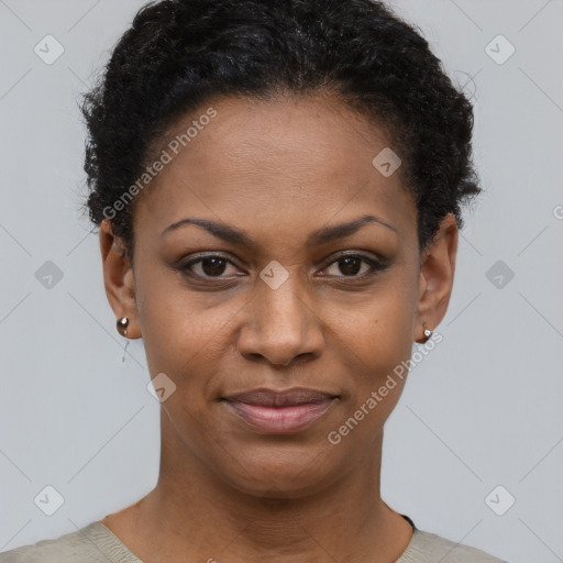 Joyful black young-adult female with short  black hair and brown eyes