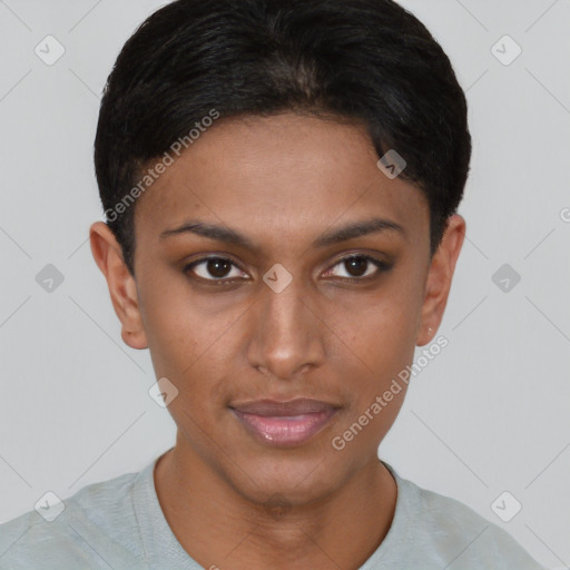 Joyful black young-adult female with short  brown hair and brown eyes