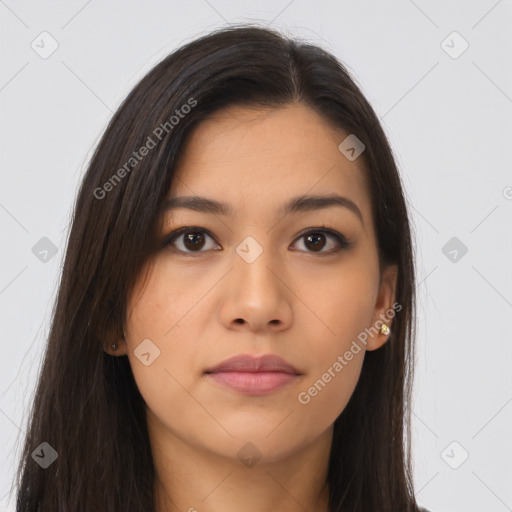 Joyful latino young-adult female with long  brown hair and brown eyes