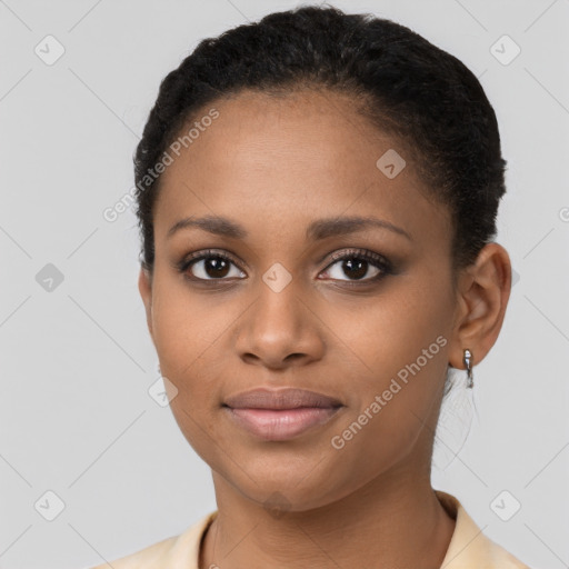 Joyful black young-adult female with short  brown hair and brown eyes