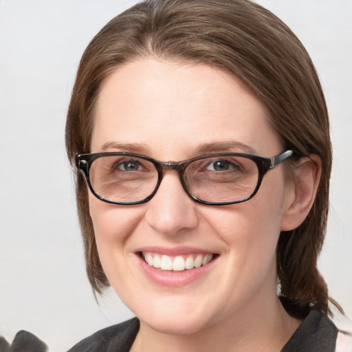 Joyful white young-adult female with medium  brown hair and blue eyes