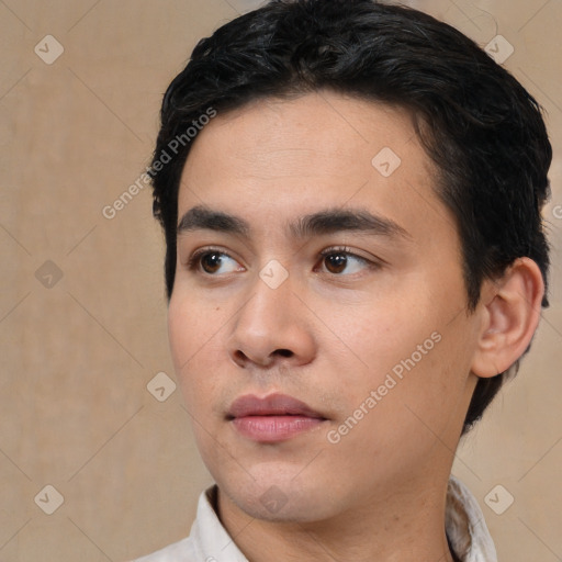 Neutral white young-adult male with short  black hair and brown eyes