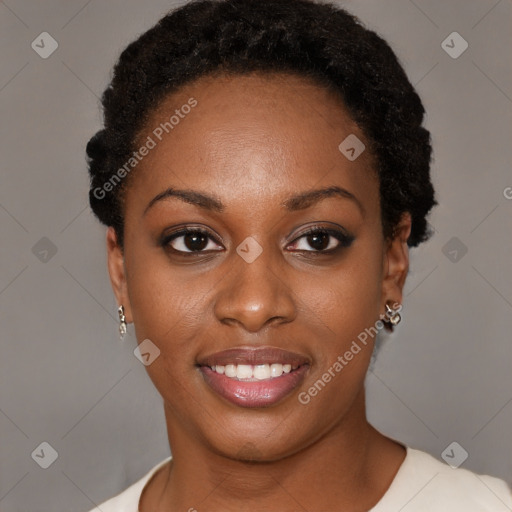 Joyful black young-adult female with short  black hair and brown eyes