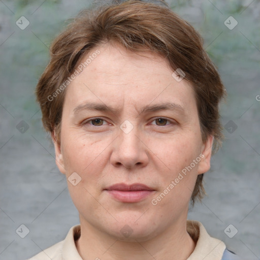 Joyful white adult female with medium  brown hair and grey eyes