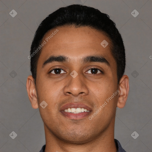 Joyful latino young-adult male with short  black hair and brown eyes