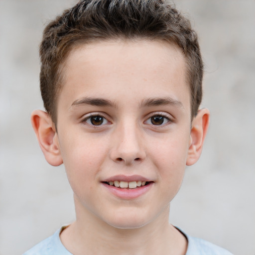 Joyful white child male with short  brown hair and brown eyes