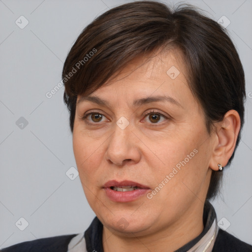 Joyful white adult female with medium  brown hair and brown eyes