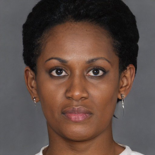 Neutral black young-adult female with short  brown hair and brown eyes