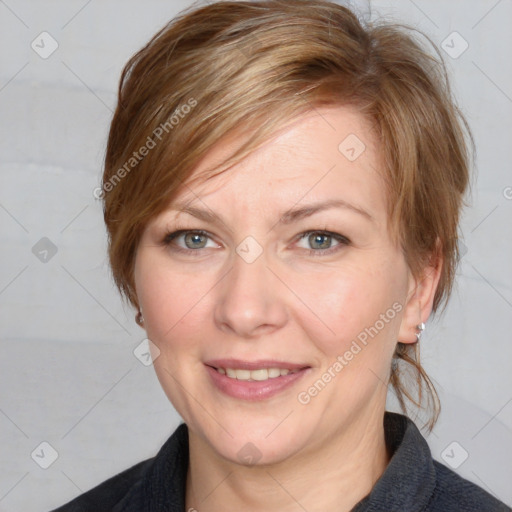 Joyful white adult female with medium  brown hair and blue eyes