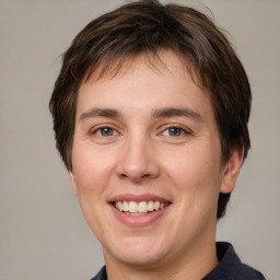 Joyful white young-adult male with medium  brown hair and brown eyes