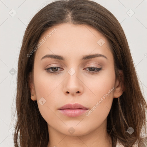 Neutral white young-adult female with long  brown hair and brown eyes