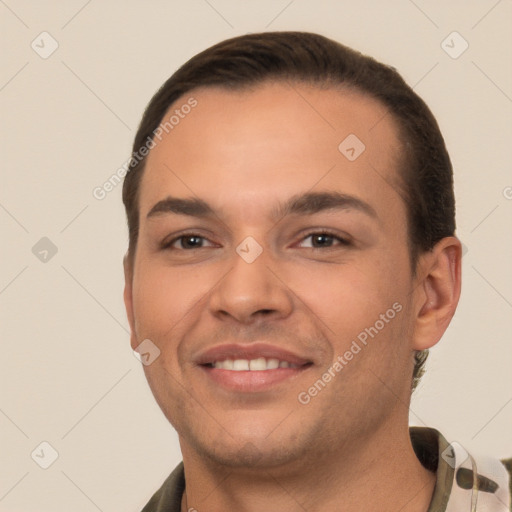 Joyful white young-adult male with short  brown hair and brown eyes