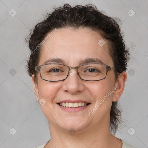 Joyful white adult female with short  brown hair and brown eyes