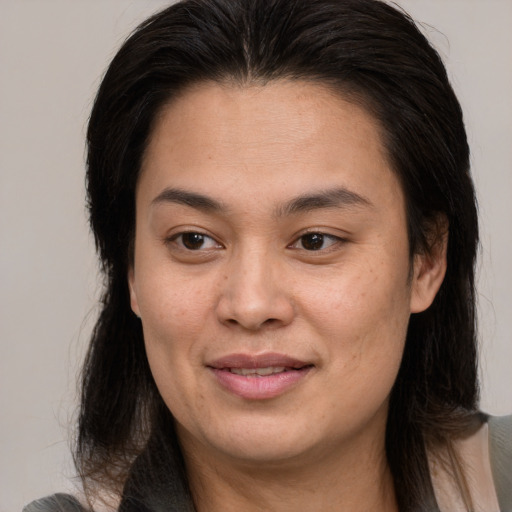 Joyful white young-adult female with medium  brown hair and brown eyes