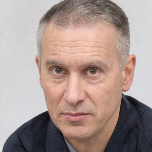 Joyful white middle-aged male with short  brown hair and brown eyes