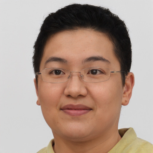 Joyful asian adult female with short  brown hair and brown eyes