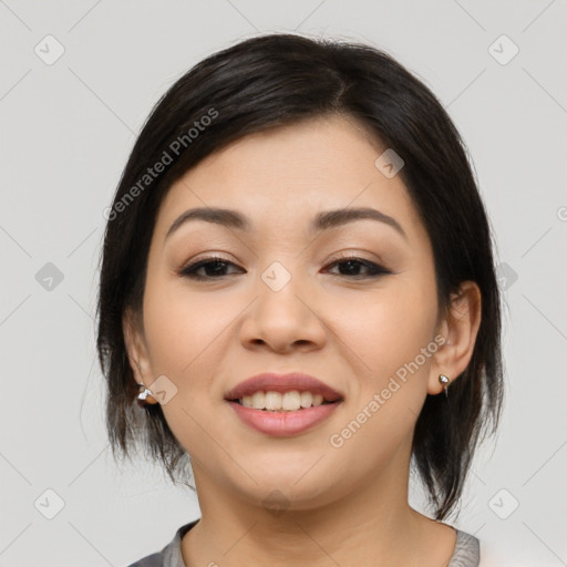 Joyful asian young-adult female with medium  black hair and brown eyes