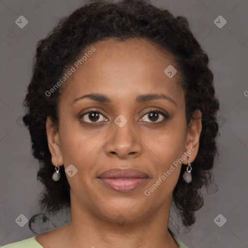 Joyful black young-adult female with medium  brown hair and brown eyes