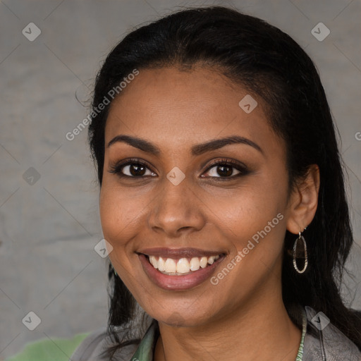 Joyful latino young-adult female with long  black hair and brown eyes