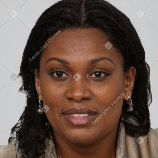Joyful black young-adult female with long  brown hair and brown eyes