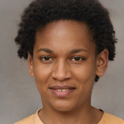 Joyful black young-adult female with short  brown hair and brown eyes