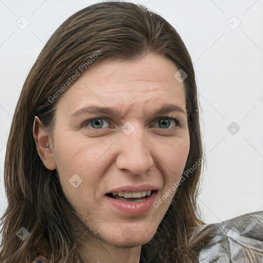 Joyful white adult female with long  brown hair and green eyes