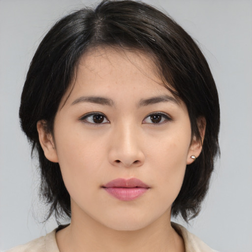 Neutral asian young-adult female with medium  brown hair and brown eyes