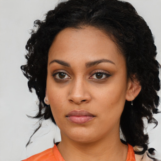 Joyful latino young-adult female with medium  black hair and brown eyes